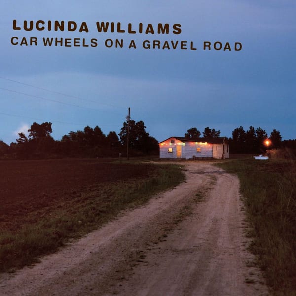 Car Wheels on a Gravel Road cover