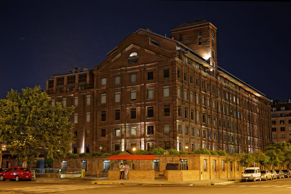 The Faena hotel building in Puerto Madero, lit at night