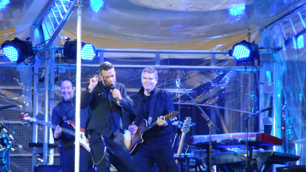 Robbie Williams on stage with his guitarist in Sunderland, 2011